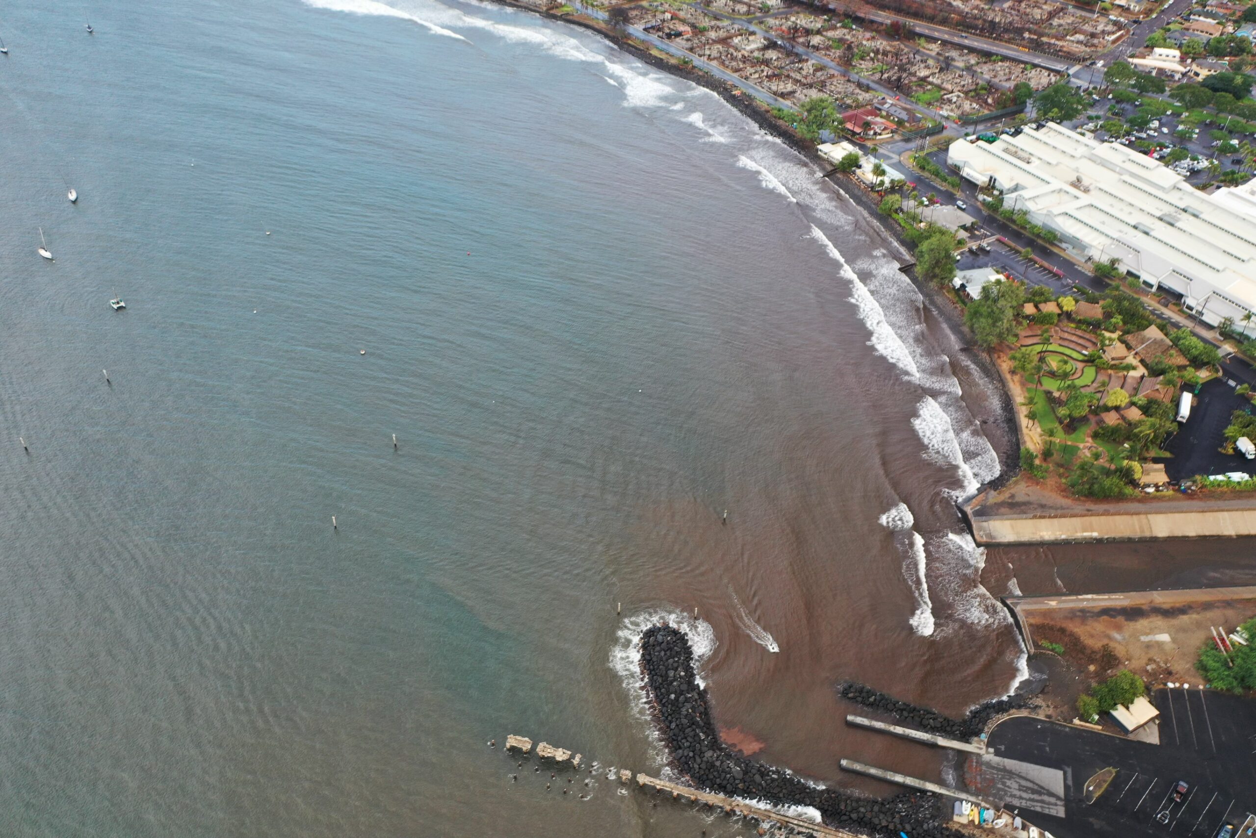 Figure X: Aerial photos of Kahoma Stream outlet after rain event. Photo credit: XXXXX 